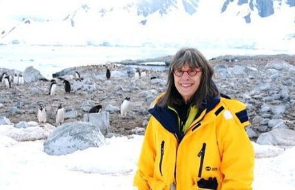 Evelyn Hannon poses with penguins