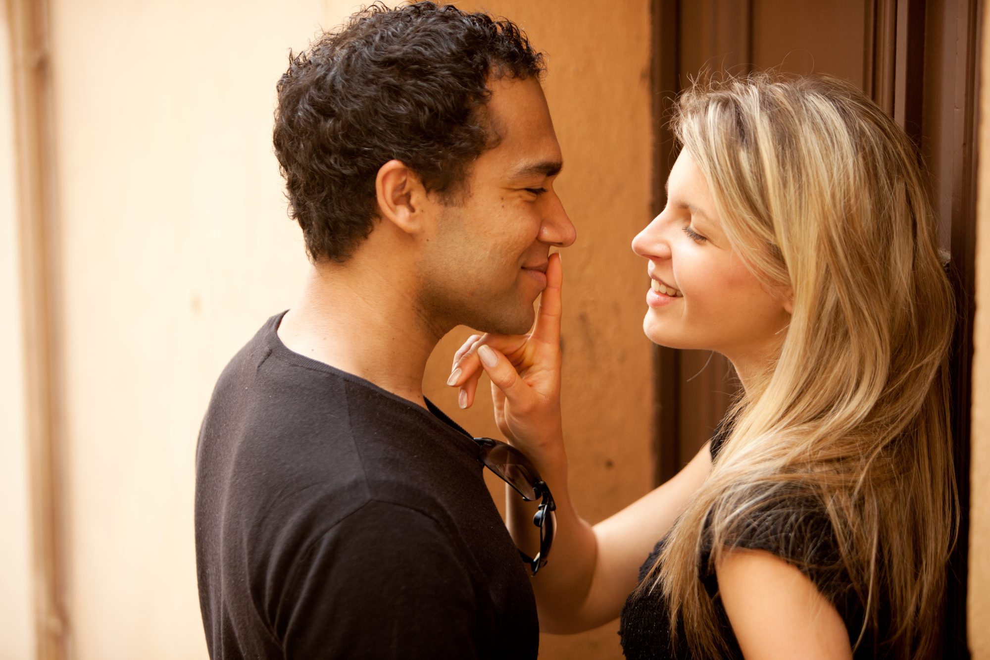 A couple flirting on a quaint street in France, Europe