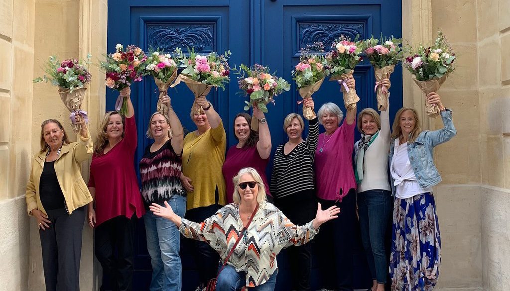 A photo of women participating in a small group tour of paris