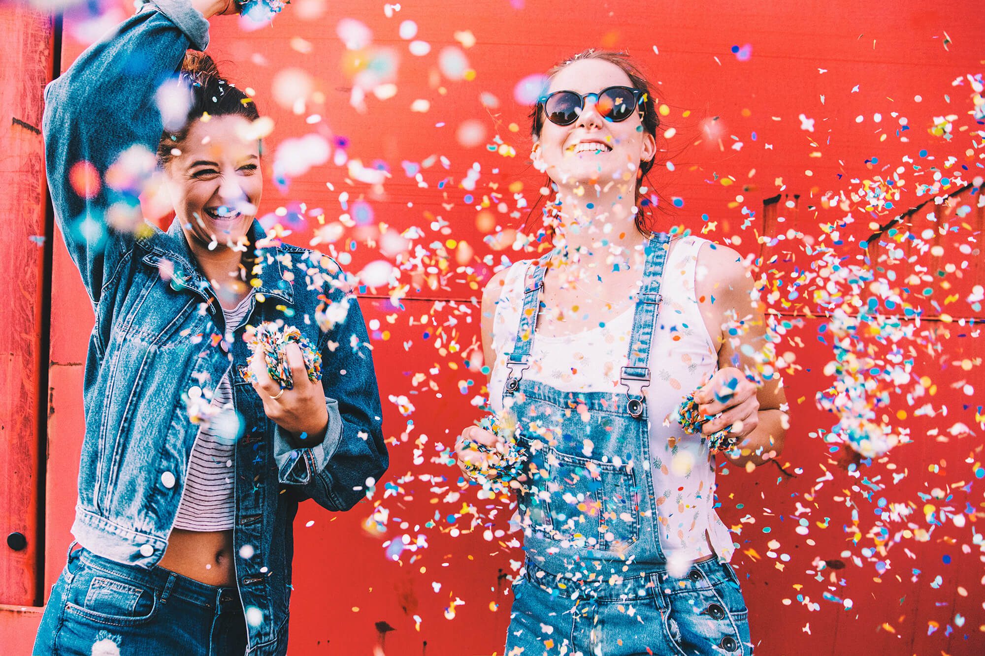 vibrant friends smiling in confetti