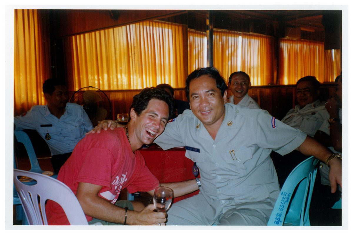 Hope's boyfriend sits with Cambodian official