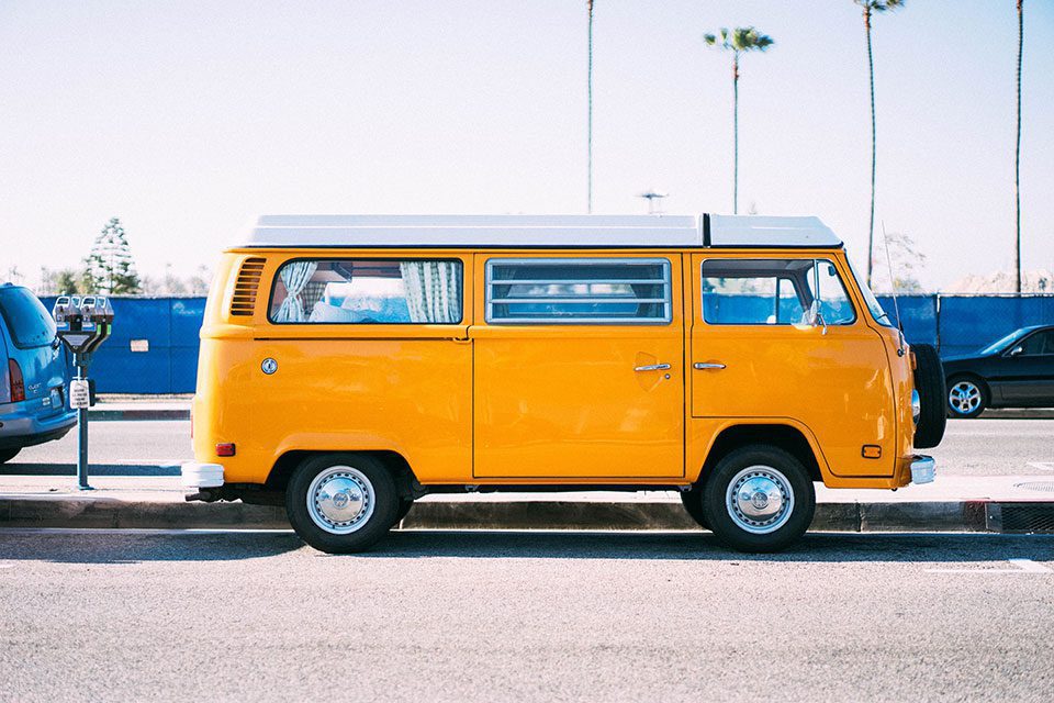 Sideview of bright yellow vintage Westfalia motorhome