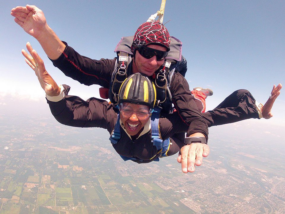 A woman skydiving and celebrating The most important love you can have is the love you have for yourself, says Nadine, who celebrated her 50th with self-love and travel.