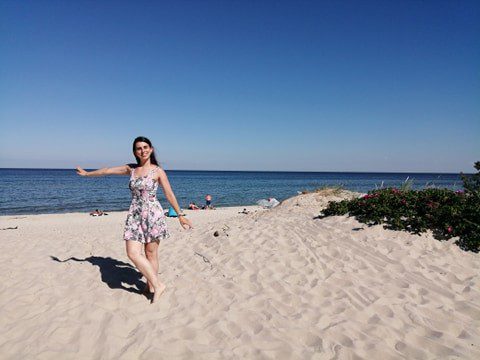 Anna smiles on Hel Beach in Hel, Poland