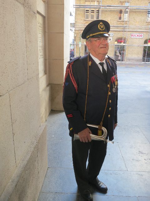 Mature soldier in uniform with a bugle