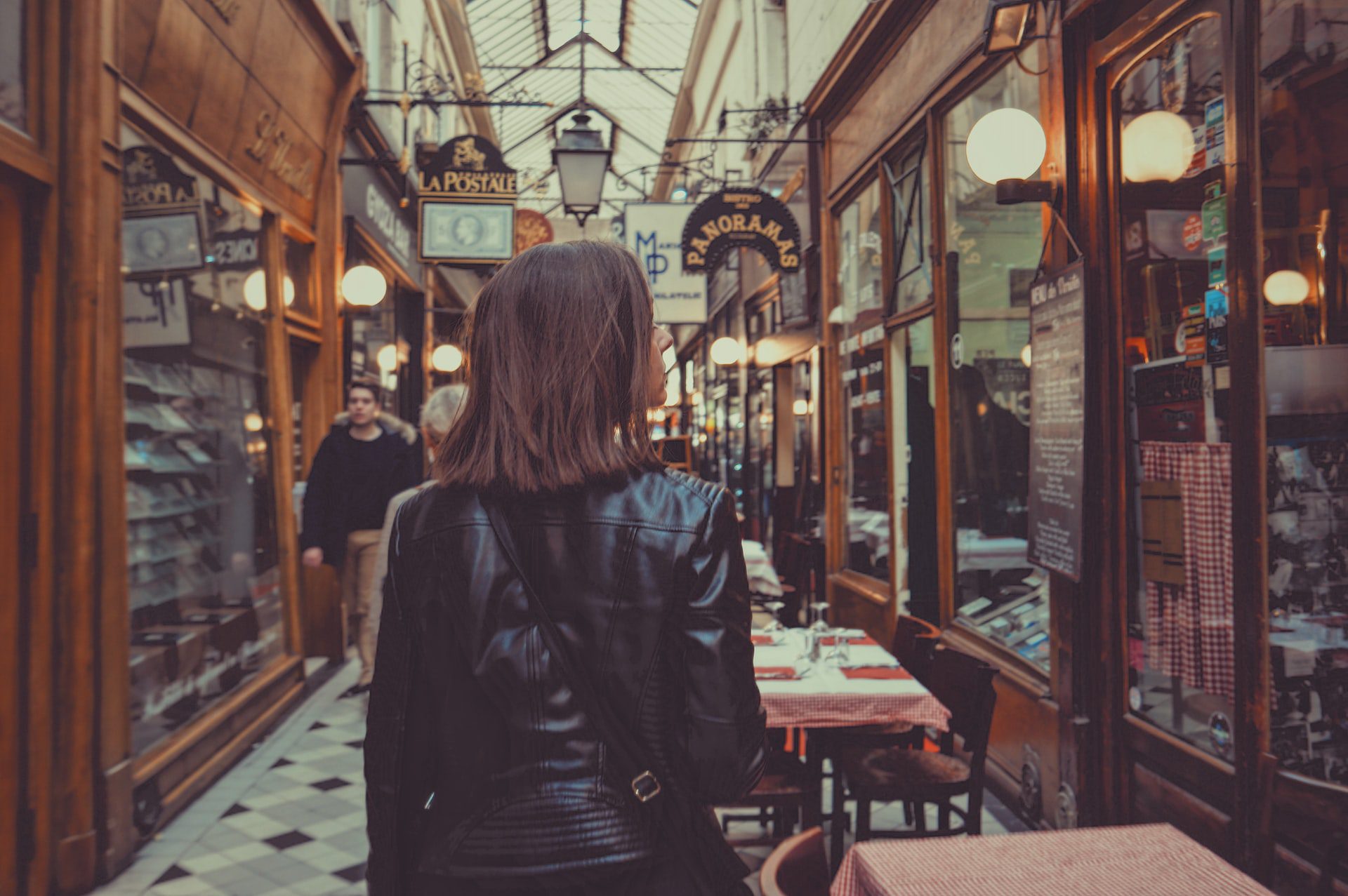 Woman explores the Passage du Panoramas in Paris