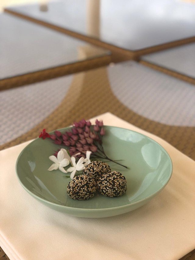 Bowl with berries and flowers for meditation