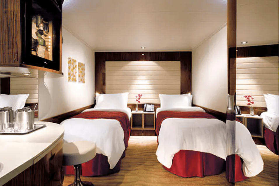 An interior cabin with two beds on a Norwegian Cruise Line's ship
