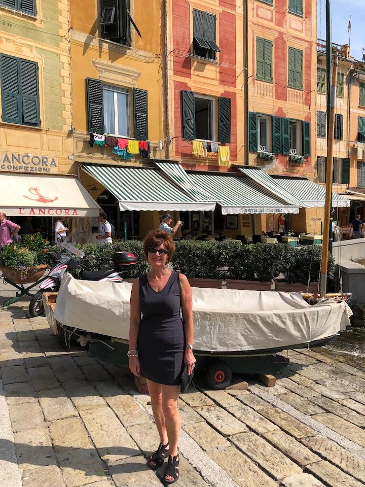 A woman standing in a European square