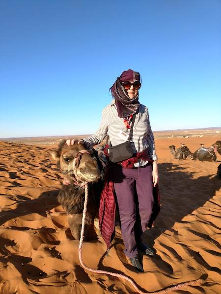 Barbara Leonard meeting new friends and picking up new fashion in Morocco, one of our featured women travellers over 65