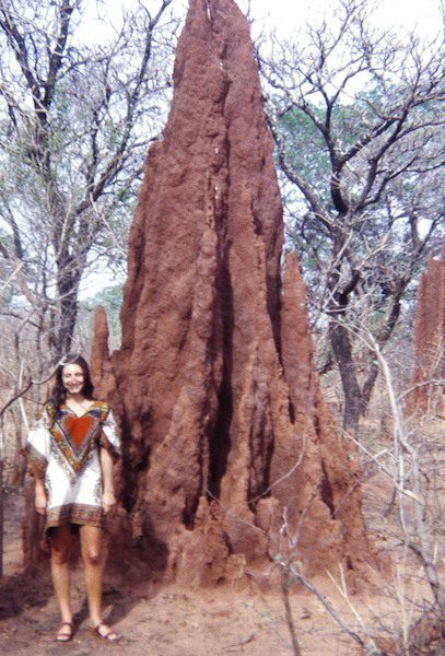 Diane and termite hill in Nigeria, 1973, one of our featured women travellers over 65
