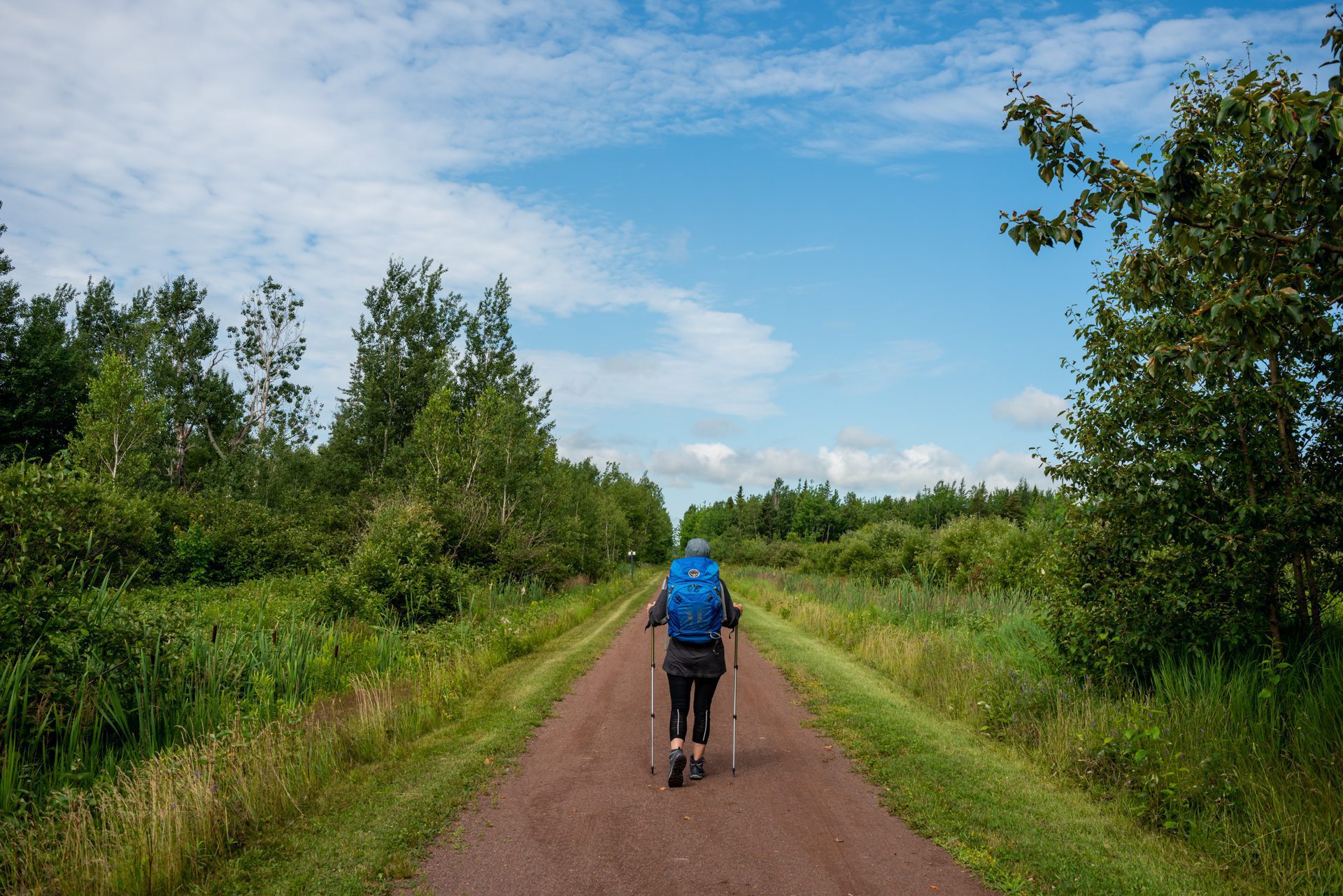 A woman walks the PEI Camino