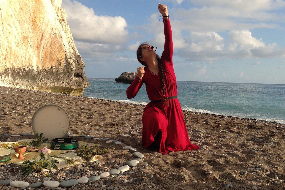 the travelling storyteller Juliana performing goddess stories and a ritual at Aphrodite’s beach, Paphos, Cyprus