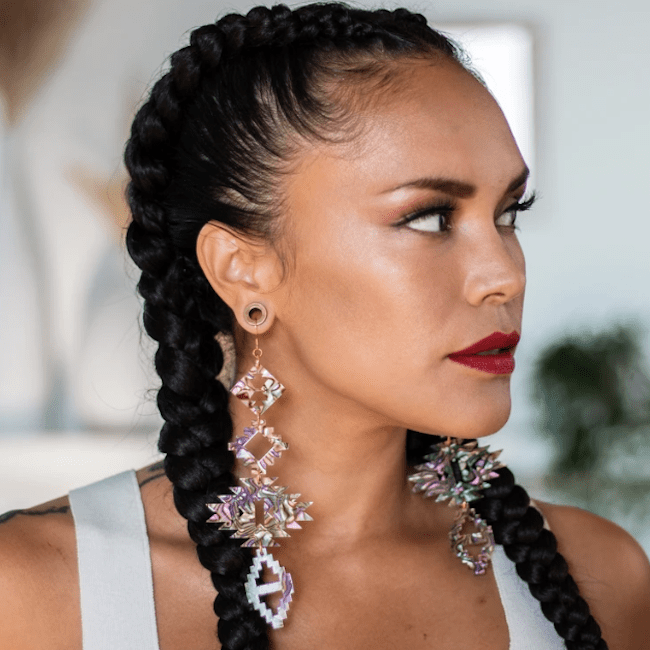 A woman wearing earrings from Indi City