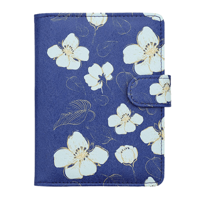 A blue passport cover with white flowers
