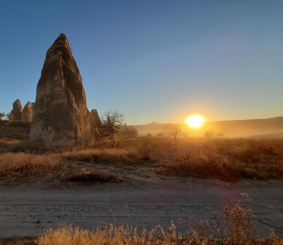 Sunset behind a large boulder in Turkey 