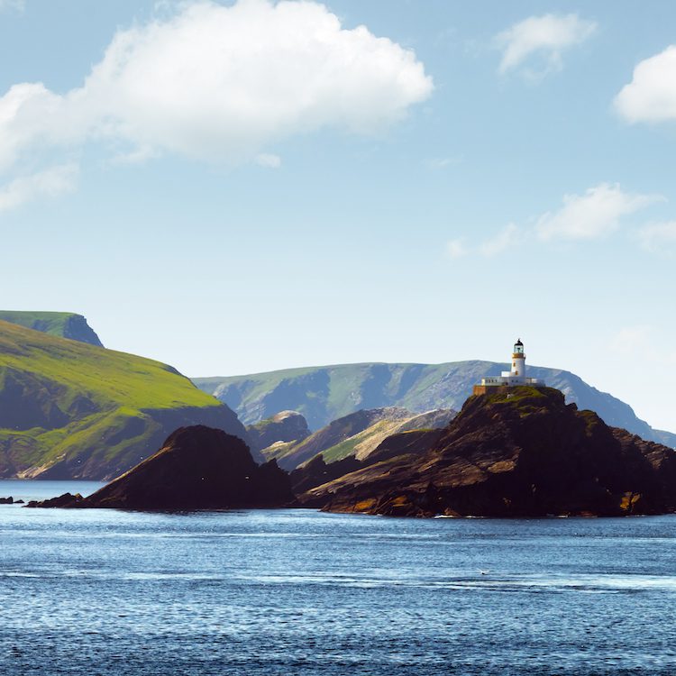 Seascape with lighthouse on the isle Muckle Flugga, United Kingdom, Scotland, Shetland Islands
