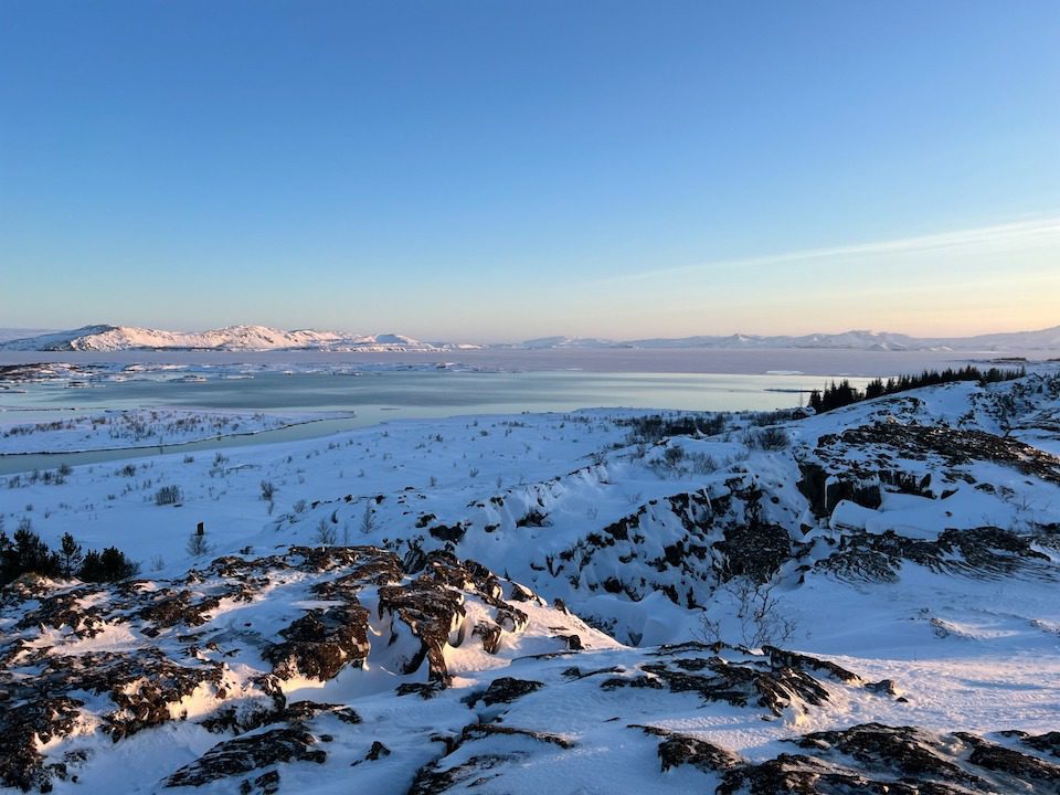 Sun setting over a snowy landscape in Iceland