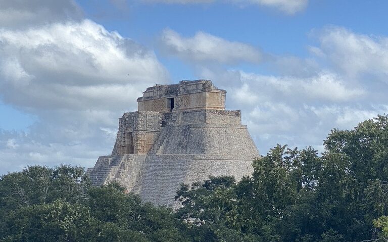 A woman walks across Hierve el Agua, Oaxaca