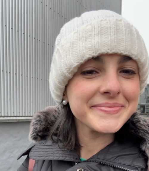 woman smiling in white hat iceland