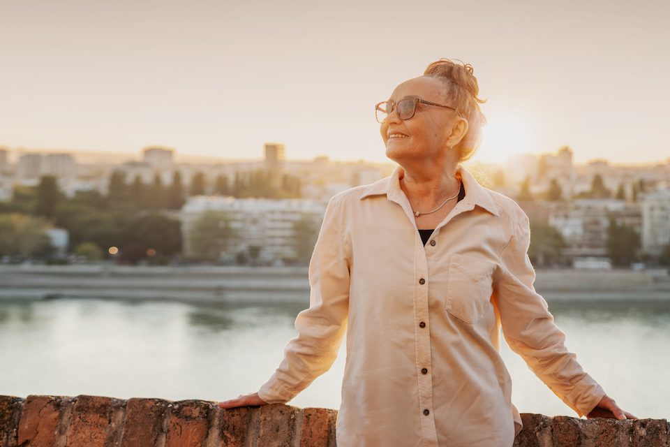 Portrait of a happ senior woman at sunset
