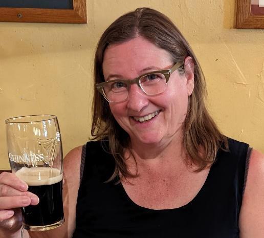 Sue enjoys a Guiness beer