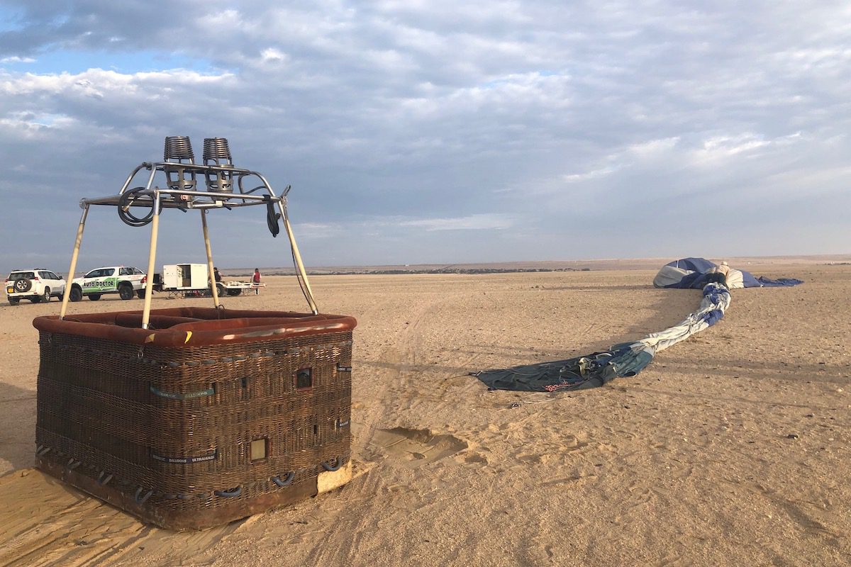 Packing up the balloon after a hot air balloon safari in the Namib Desert, Namibia