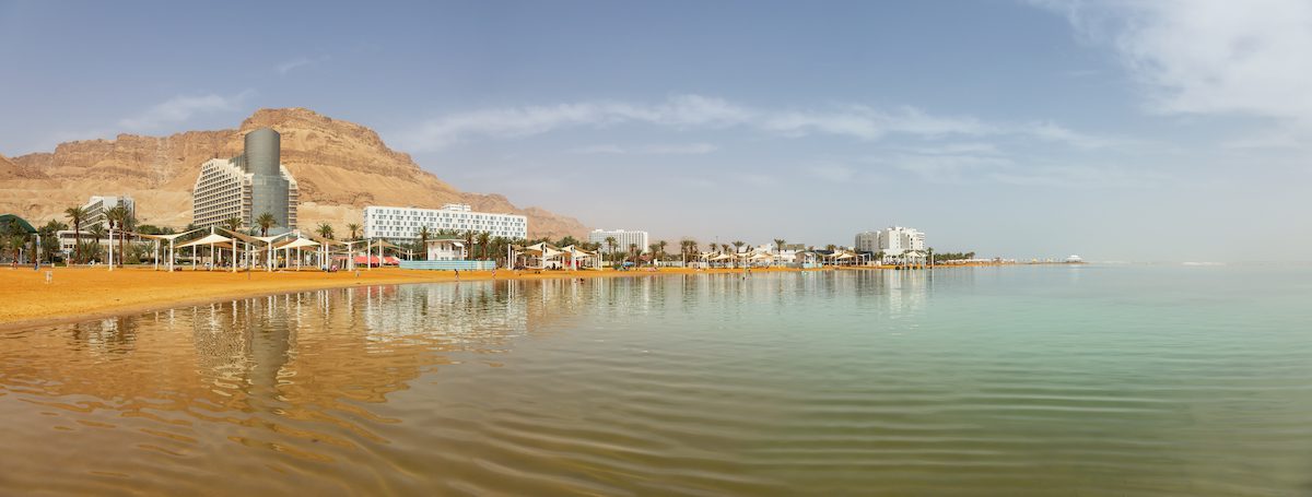 Panoramic view of the sandy beach near the Vacation Resorts at the Dead Sea. Taken in Ein Bokek, Israel.
