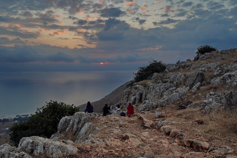 The hikers enjoying the sunrise over the Sea of Galilee from the Golan Heights Israel
