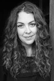 Author Isabel Allende surrounded by books
