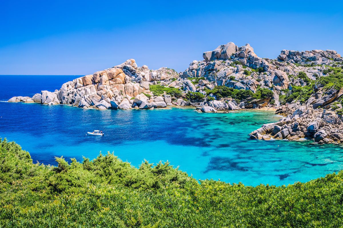 Turquoise water and rocky cliffs in Capo Testa, Sardinia
