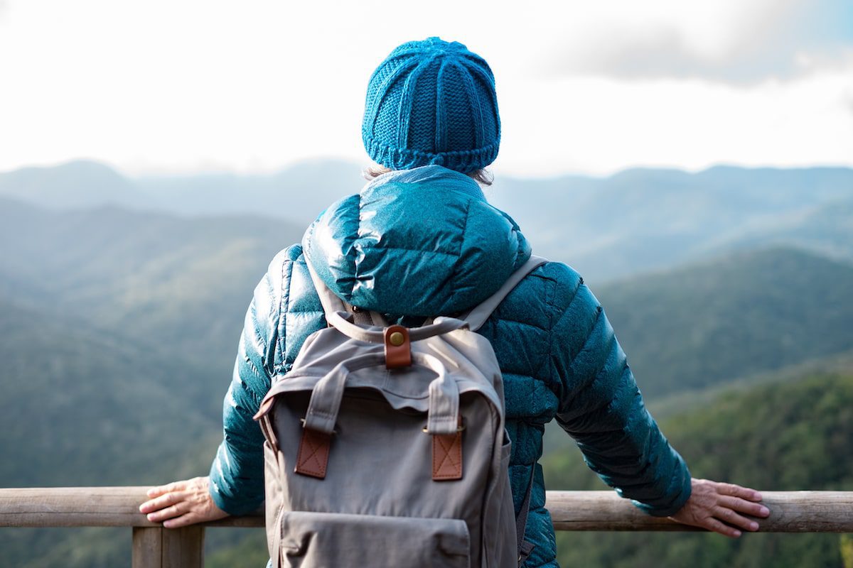 A woman hiker overlooks the mountains