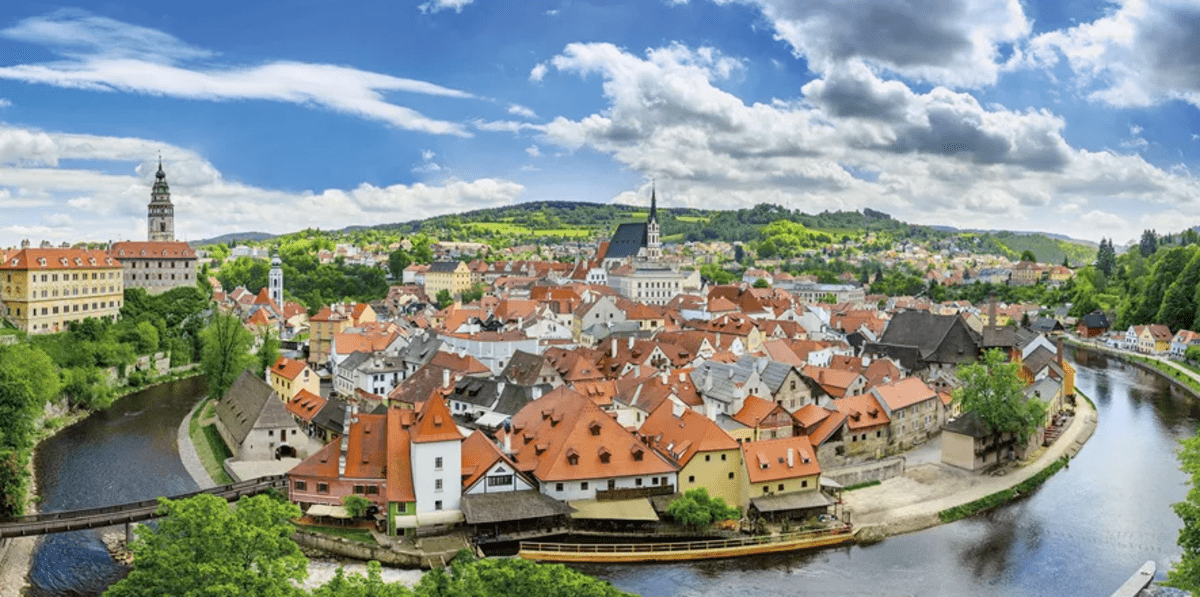 photo of a river and small european town