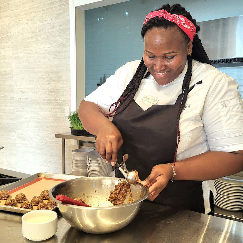 Chef Lindsey jokes with participants as she whips up a yummy recipe during a cooking class at The Retreat’s teaching kitchen.