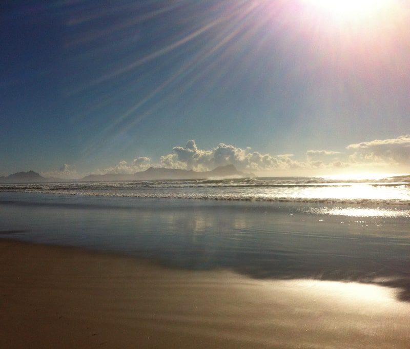 Sunset on a beach in Northland, New Zealand