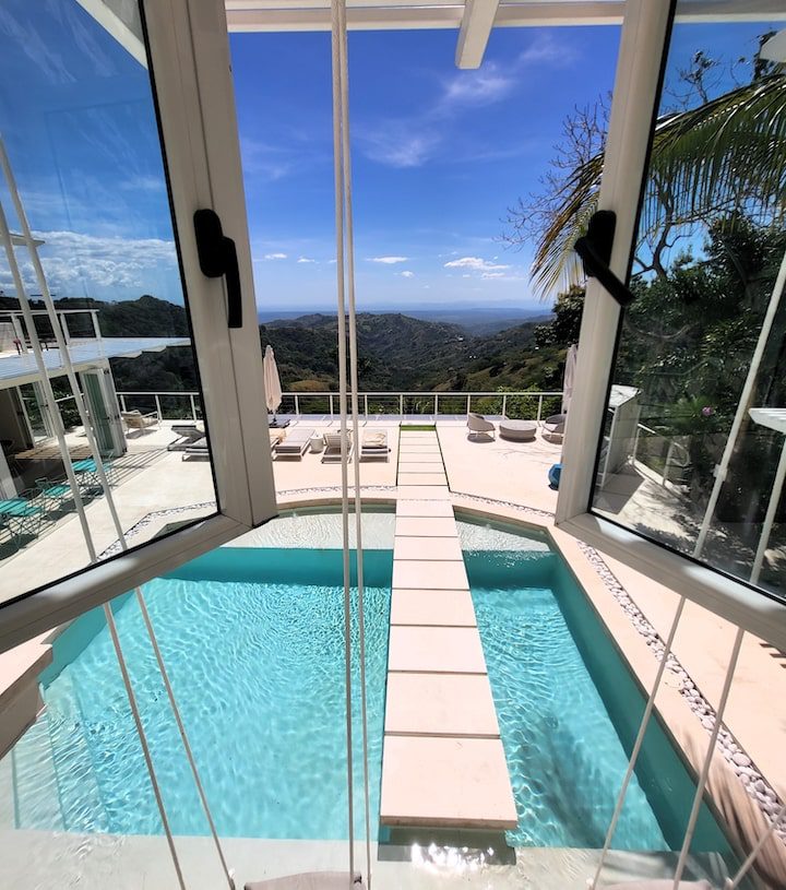 From the second-floor window of The Retreat’s Vida Mia Healing Center and Spa, the saltwater pool, swings and lounge area below beckons