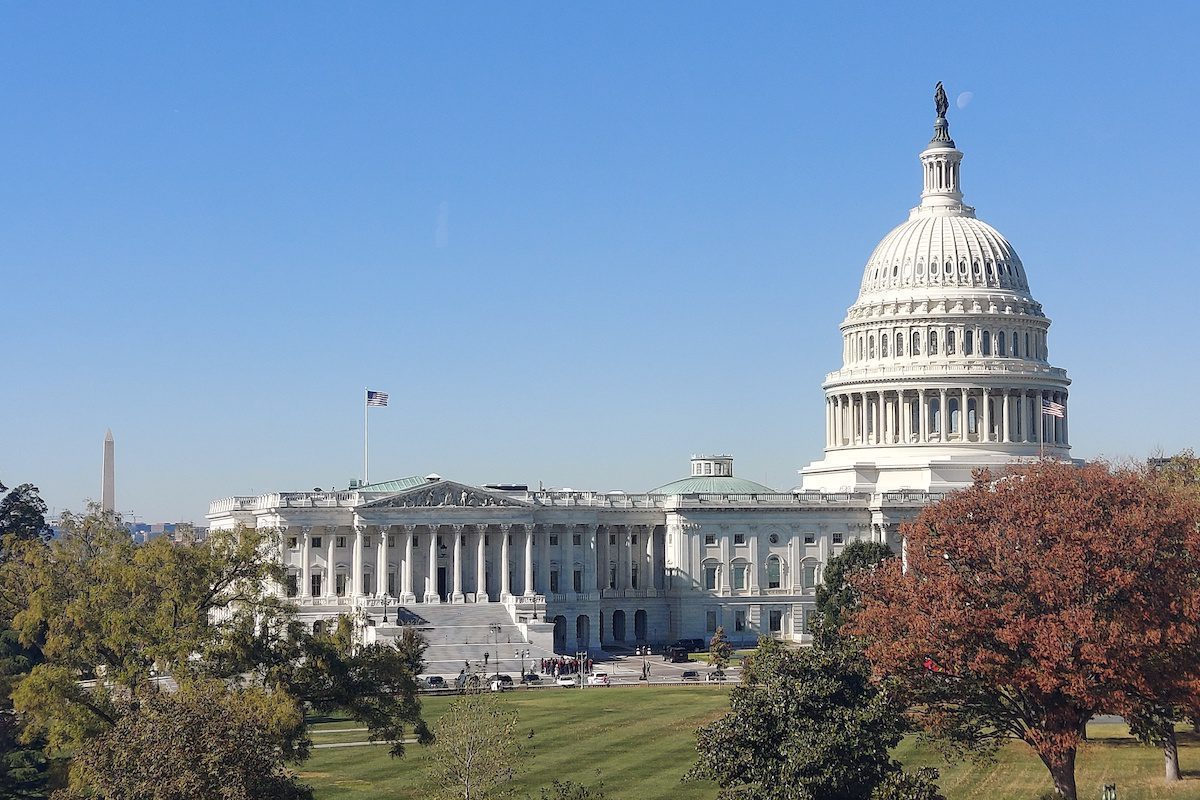 Washington D.C. US Capitol with Washington Monument in distance