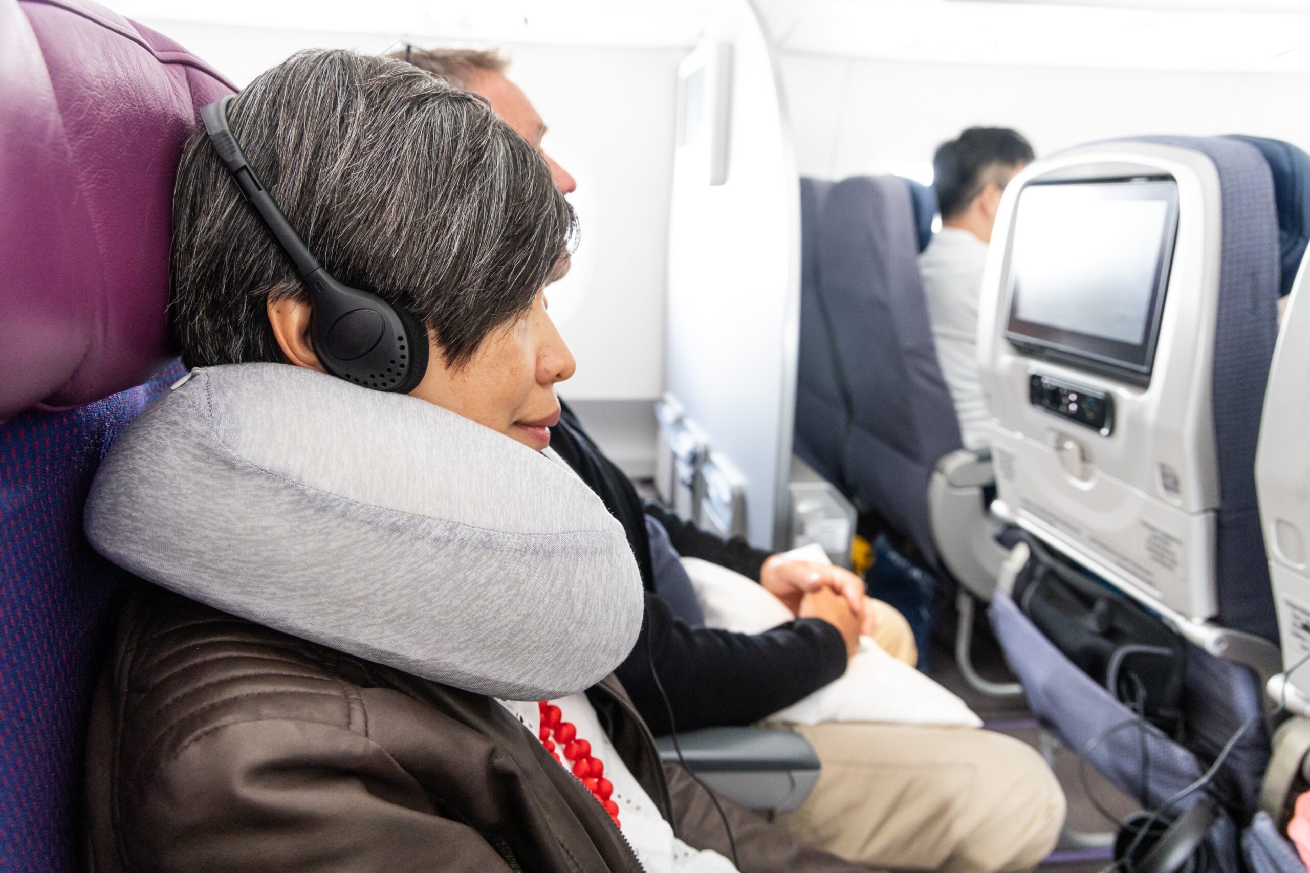 how to get over jet lag woman airplane