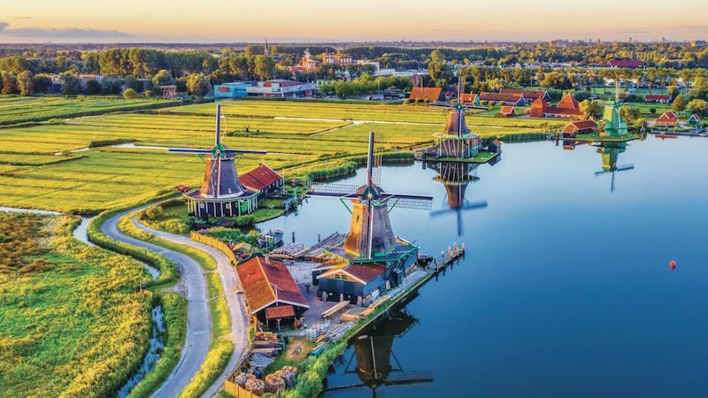 Windmills along a canal in the Nederlands