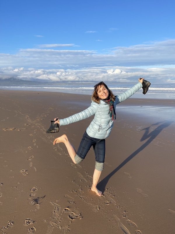 Cynthia Dale on a beach in Dornoch, Scotland