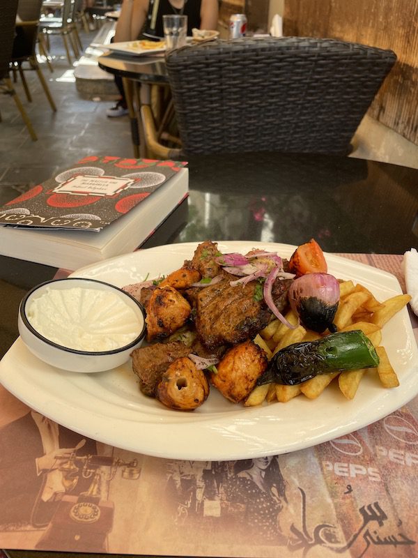 Lebanese food enjoyed at a market in Doha