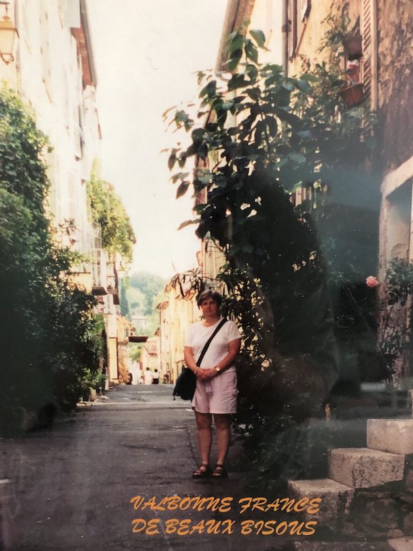 Heather posing on a street in France