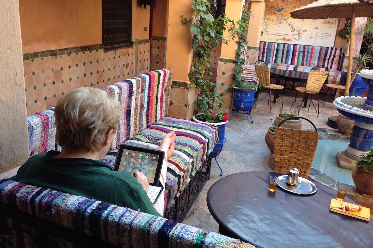 Leyla Alyanak working on her blog while traveling