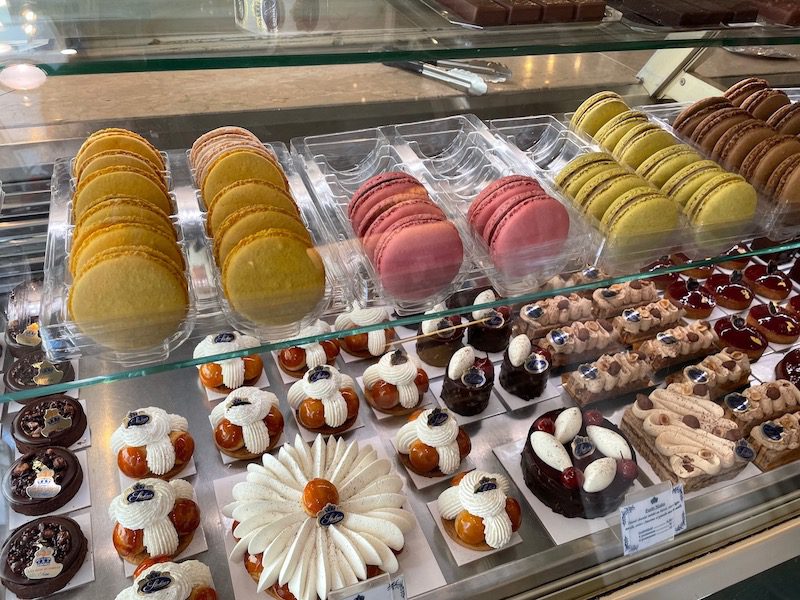 Pastries line a shop on a food tour in Paris
