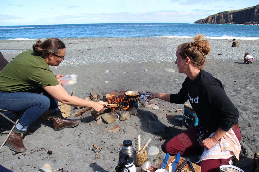 Lori Mccarthy and Marsha Tulk having a fire on the beach