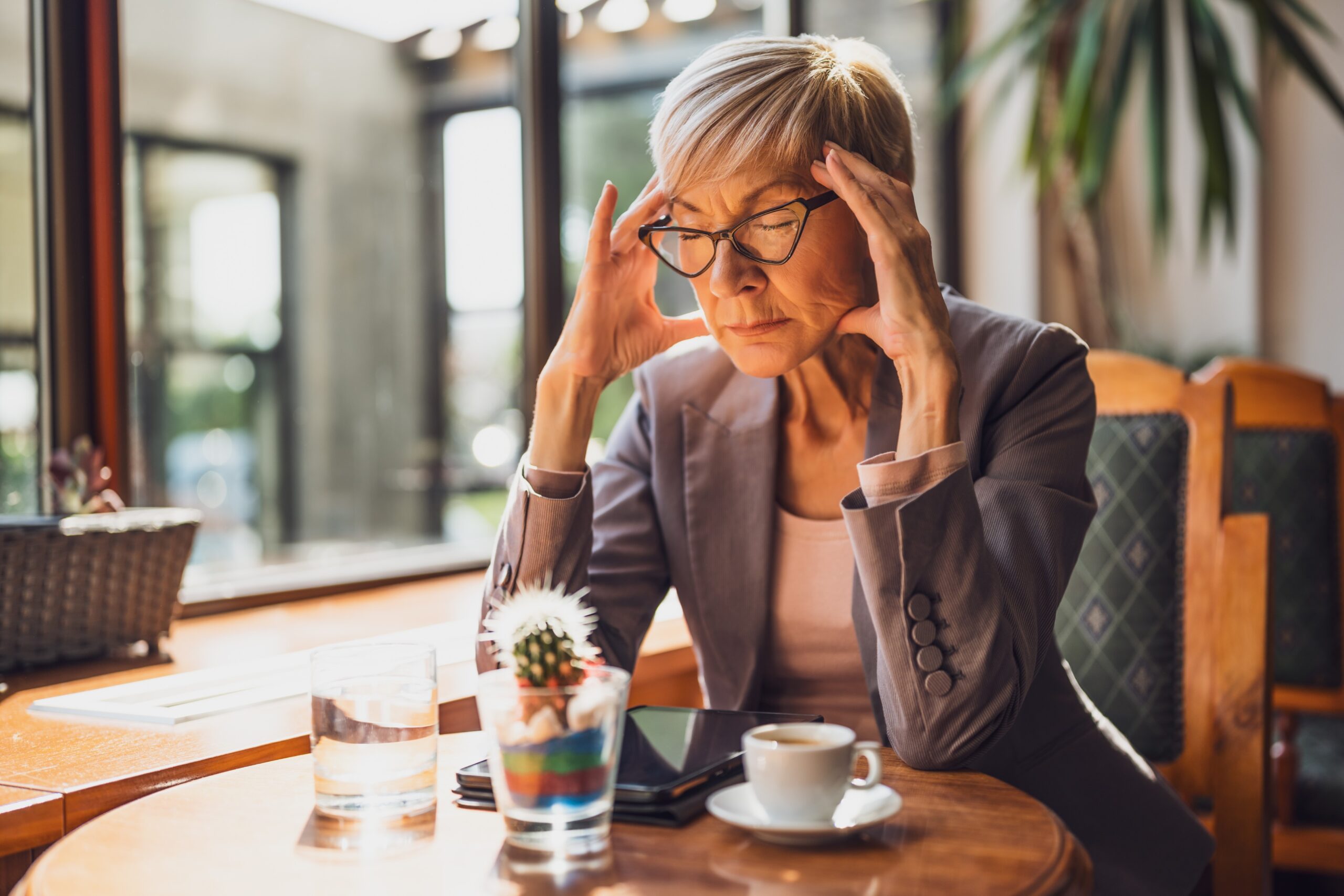 older woman feeling invisible in a bar