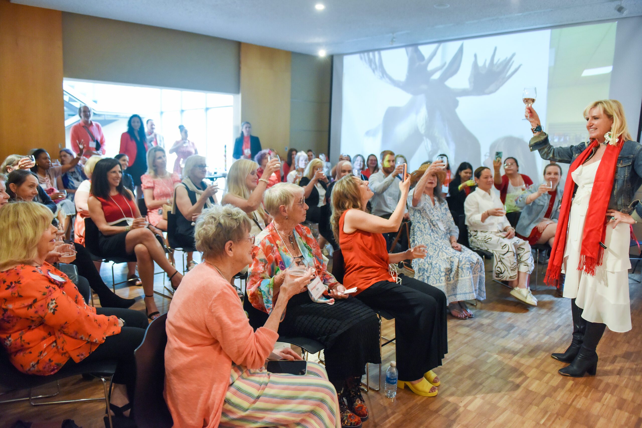 group of women holding a glass to toast evelyn hannon