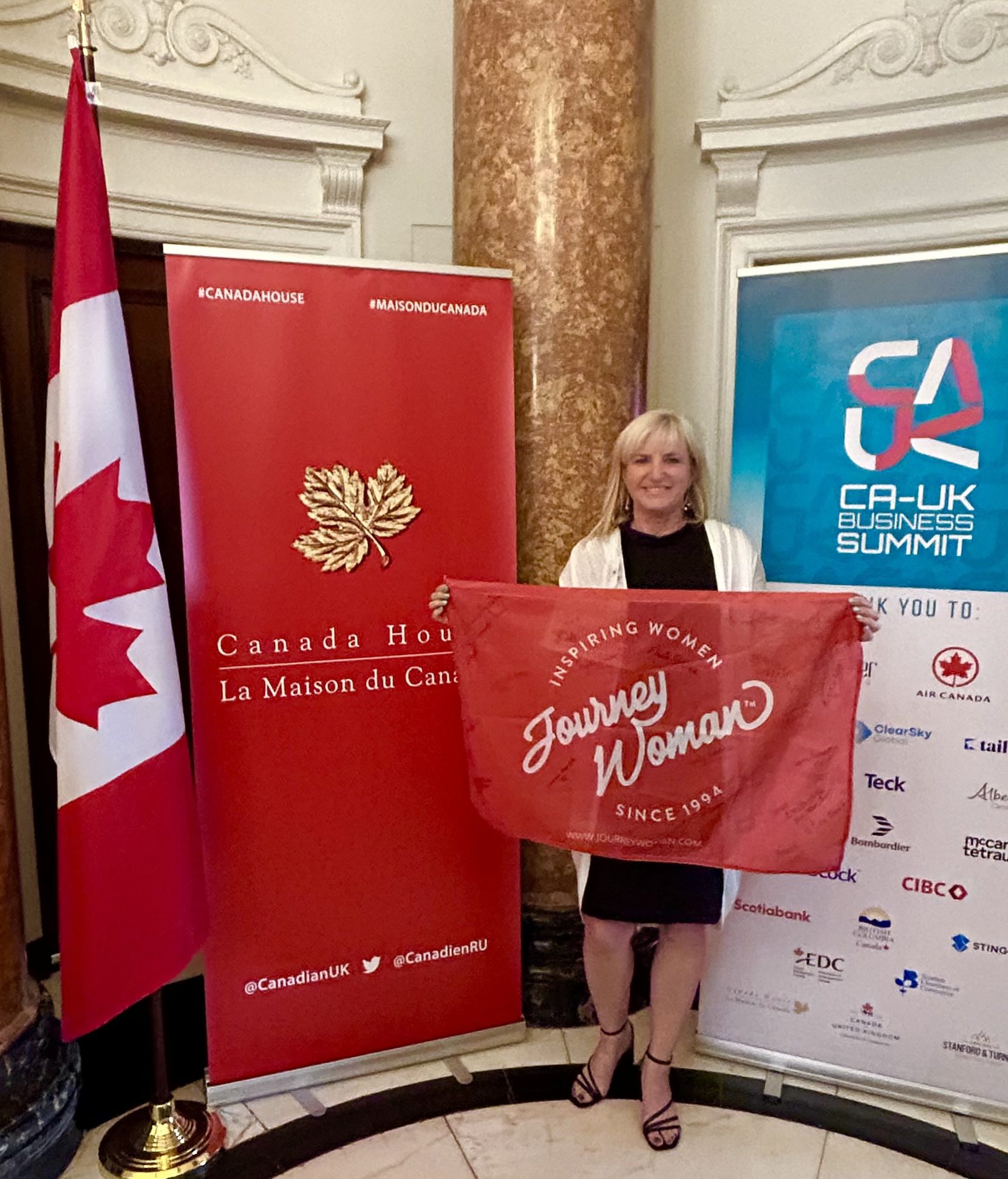 smiling woman holding flag in london uk 