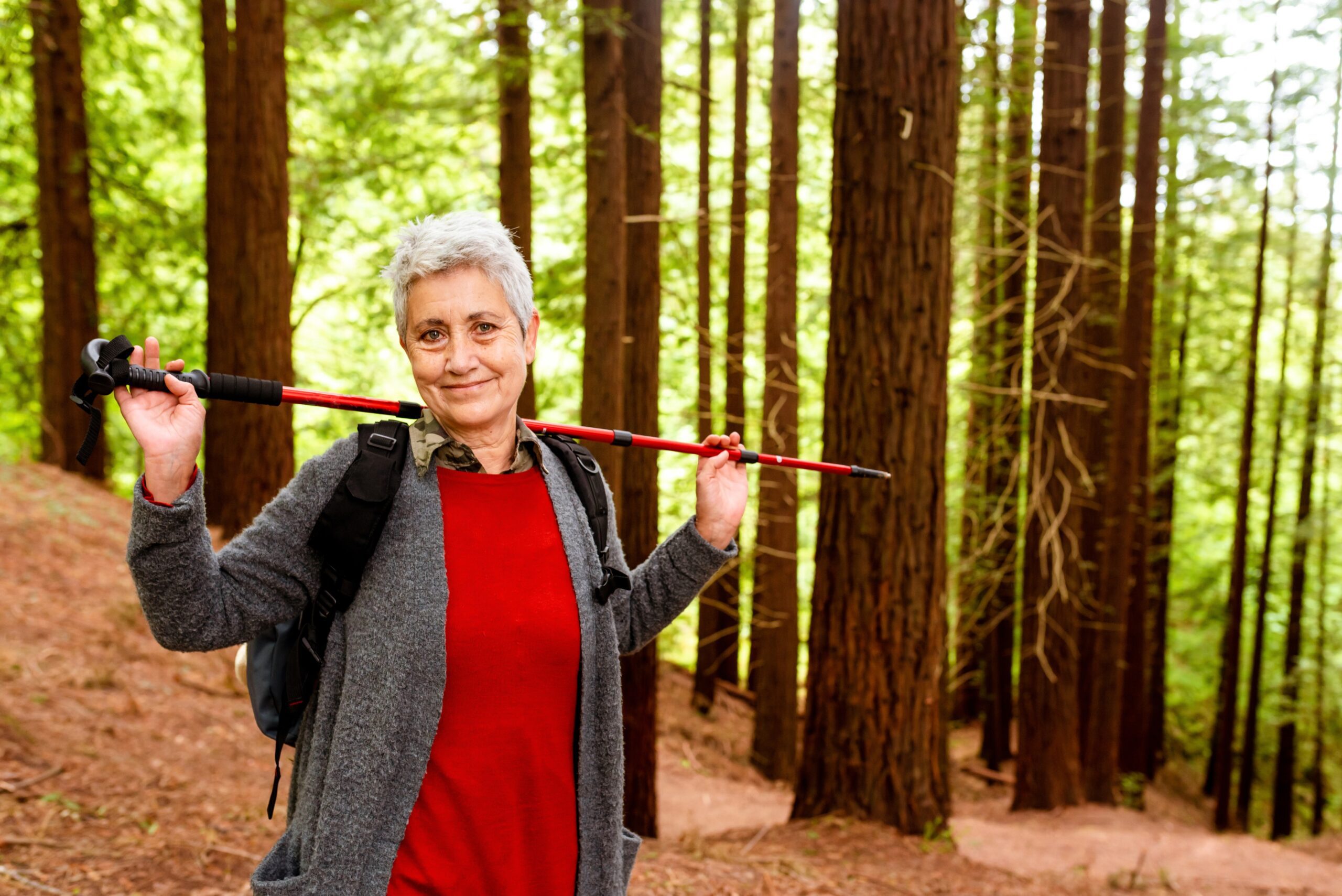 woman over 50 hiking in the forest