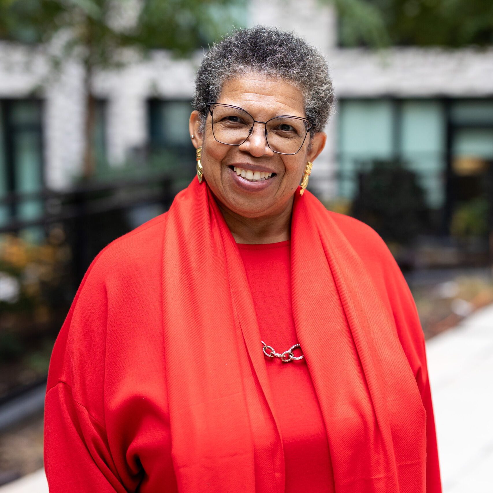 Mary K Clark red shirt smiling woman
